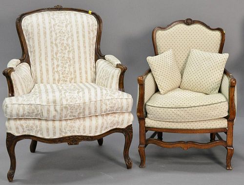 Two Louis XV style armchairs with clean upholstery.