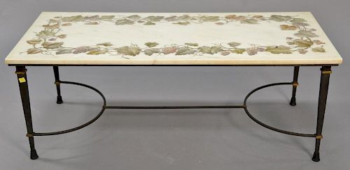 Marble top coffee table with grape vine design on metal base. ht. 16 1/2", top: 21" x 45"