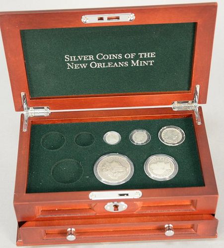 Silver Coins of The New Orleans Mint, (missing three out of eight coins), in fitted wood box.