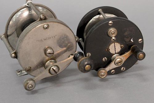 Two bait casting reels including one Hendryx and one bakelite.