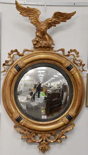 Two contemporary convex mirrors with eagle top, one as is