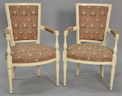 Pair of French style white painted armchairs.