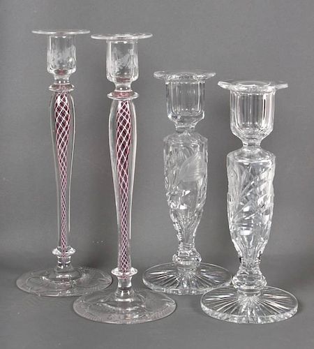 Two pairs of glass candlesticks