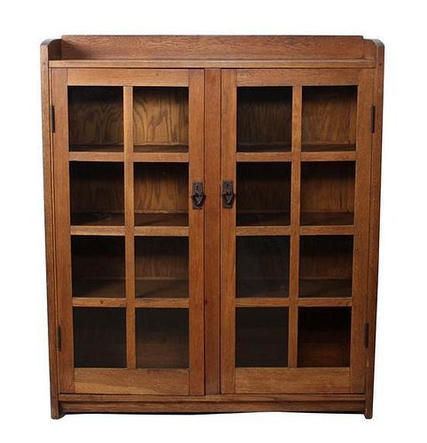 A Gustav Stickley Oak Two Door Bookcase Height 56 x width 47 1/2 x depth 13 inches