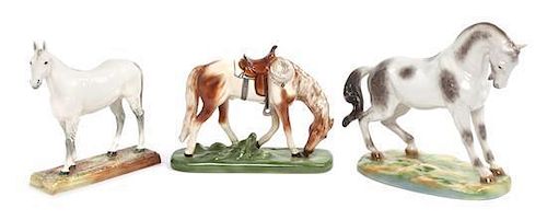 A Collection of Three Porcelain Figures Width of widest 13 1/2 inches.