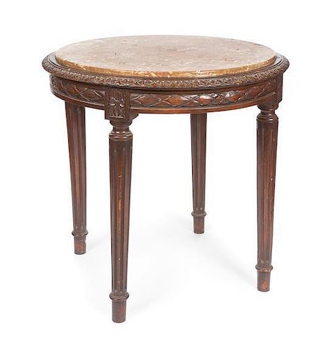 * A Louis XVI Style Occasional Table Height 29 1/2 x diameter 23 inches.
