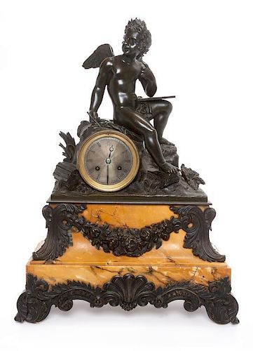 * A Continental Bronze and Marble Figural Clock Height 19 3/4 inches.