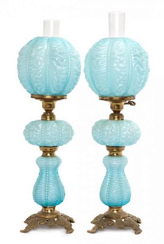 * A Pair of Victorian Style Molded Glass Table Lamps Height overall 24 inches.