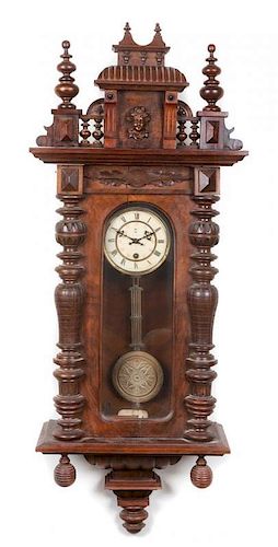 * A Victorian Walnut Regulator Clock, Junghans Height 48 inches.