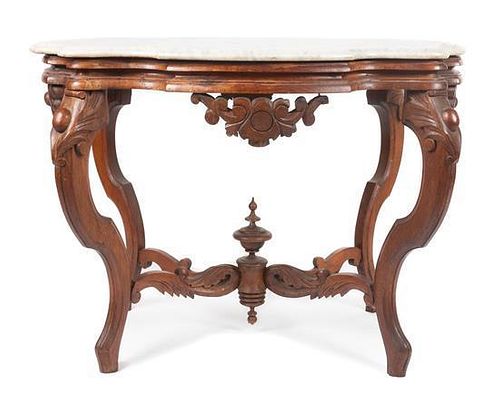 * A Victorian Walnut Parlor Table Height 27 x width 35 x depth 24 inches.