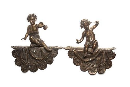 * A Pair of Cast Metal Figural Ornaments Height 11 3/4 inches.