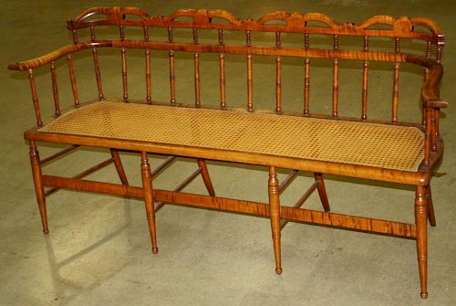 fancy Sheraton curly maple cane seat settee, flared arms, pierced crest, delicate proportions. Circa