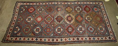 early 20th c Caucasian area rug, uneven wear, 3'7” x 6'8”