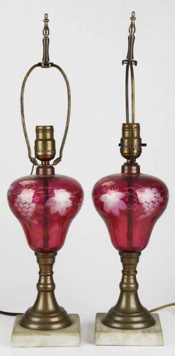 pr of Bohemian flashed cranberry cut to clear glass font gilt brass table lamps, overall ht 22.5”
