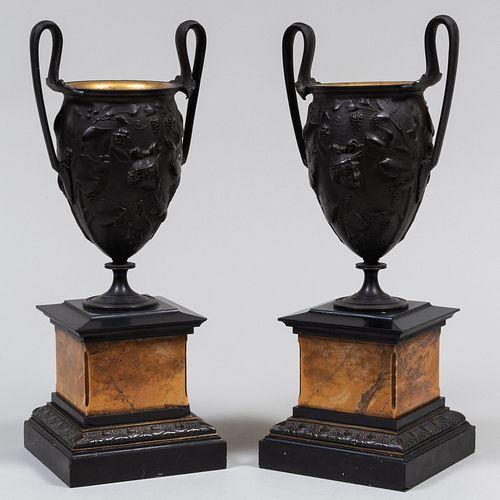 Pair of Italian Patinated Metal and Marble Campana Form Urns