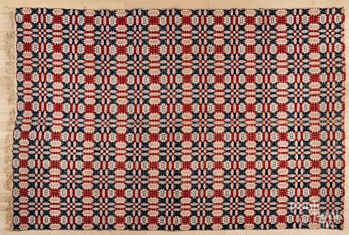 Red, white, and blue coverlet, mid 19th c., 62'' x 92''.