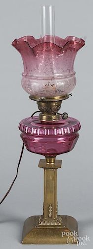 Brass fluid lamp with a ruby reservoir and shade, 25 1/2'' h.