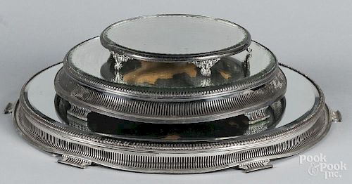 Three silver-plated mirrored plateaus, 15 1/2'' dia., 21'' dia., and 10'' dia.