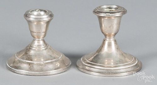 Two pairs of sterling silver weighted candlesticks, 3 1/2'' h. and 4 1/4'' h.