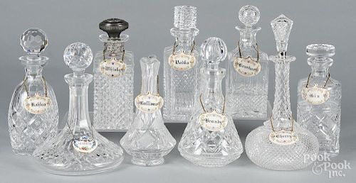 Four Waterford crystal liquor bottles, together with a pitcher and four unsigned decanters