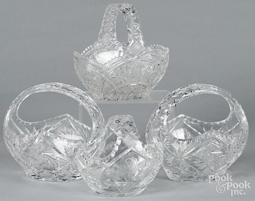 Four cut and pressed glass baskets, largest - 8'' h., 8 1/2'' w.