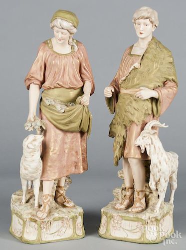 Pair of Royal Dux bisque figures of a young man and woman, 20 3/4'' h. and 20'' h.