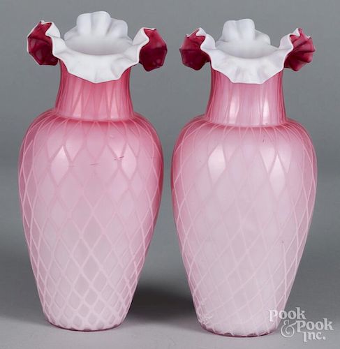 Pair of quilted satin glass vases, 10 1/2'' h., together with two etched pink glass vases, 10 1/4'' h.