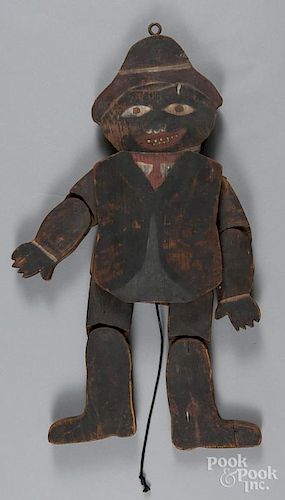 Folk art painted pine articulated figure of an African American boy, early 20th c., 22'' h.