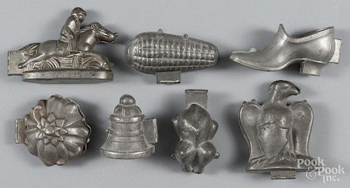 Seven lead chocolate molds, to include an eagle, a turkey, a horse and rider, etc.
