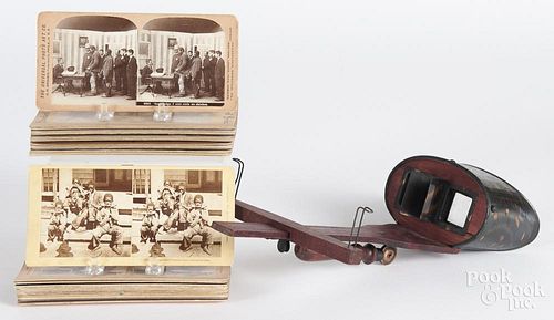 Thirty-five Black Americana stereo viewer cards, ca. 1900, together with a stereo viewer.