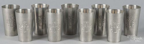 Nine pewter beakers, 20th c., with an engraved armorial, 5'' h.