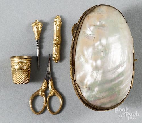 Abalone shell sewing kit, 19th c., with a gold thimble, scissors, a bodkin and a needle threader