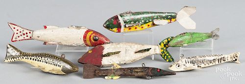Seven carved and painted fish decoys, mid 20th c., one initialed BN, longest - 7 1/2''.