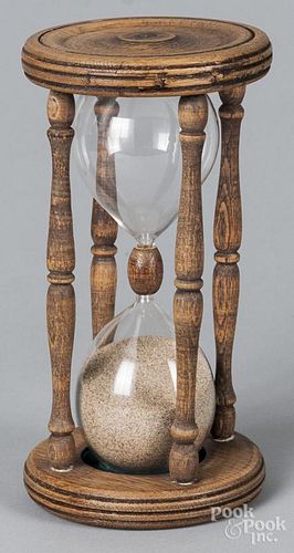 Turned oak sand timer, 10'' h., together with a coffee mill.