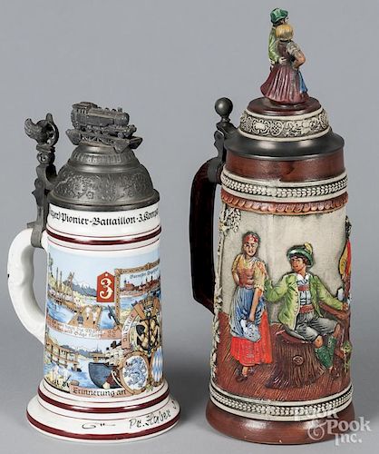 Two German steins, early 20th c., 9 1/2'' h. and 12 1/4'' h.