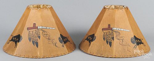 Pair of painted hide table lamp shades with Native American motifs, 10 1/2'' h., 18'' w.