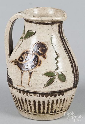 Sgrafitto decorated pottery pitcher, 8 1/2'' h.