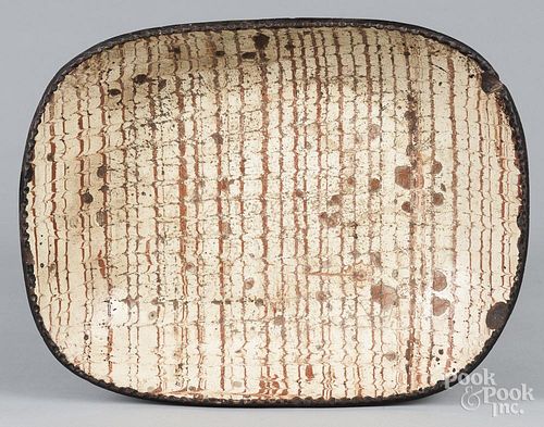 Comb decorated redware loaf dish, 19th c., 13 1/4'' h., 17'' w.