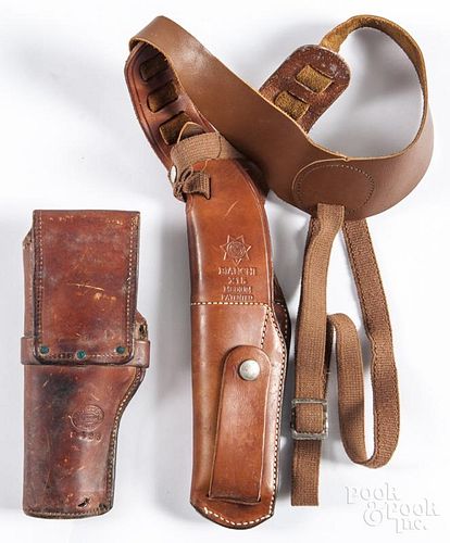 Two leather gun holsters, 20th c., to include a Bianchi shoulder holster X15 and a H. H. Heiser.