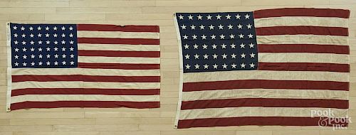 Three American flags, to include two 48 star flags and one 50 star flag, largest - 5' x 9'.