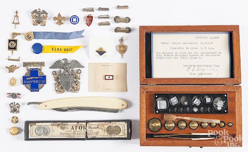 Miscellaneous military medals, pins, and badges, together with a straight razor