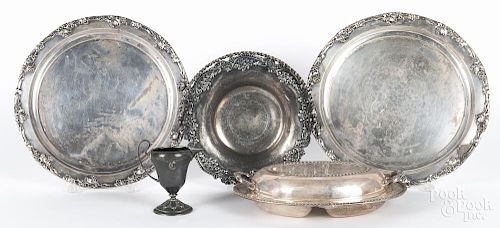 Silver-plated flatware and serving pieces.