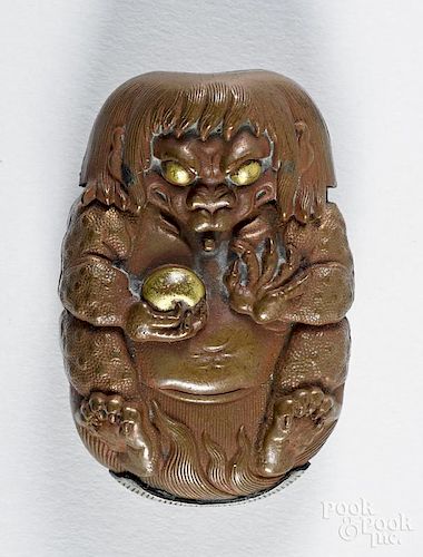 Japanese mixed metal figural demon match vesta safe, ca. 1900, with an orb, 2 1/4'' h.