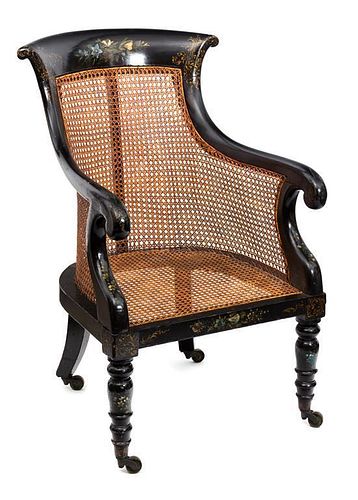 A Late Regency Black and Gilt Japanned Mahogany Library Armchair Height 35 1/2 inches.