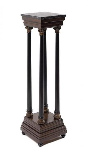 An Ebonized and Gilt Marble-Top Pedestal Height 43 7/8 inches.