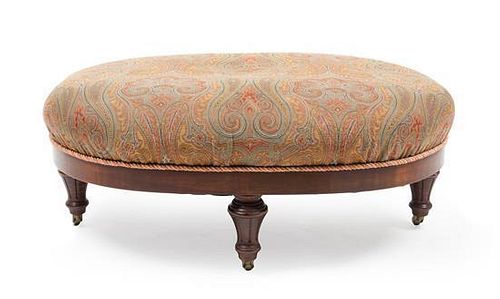 An Early Victorian Paisley-Upholstered Walnut Stool Height 16 x width 36 x depth 25 inches.