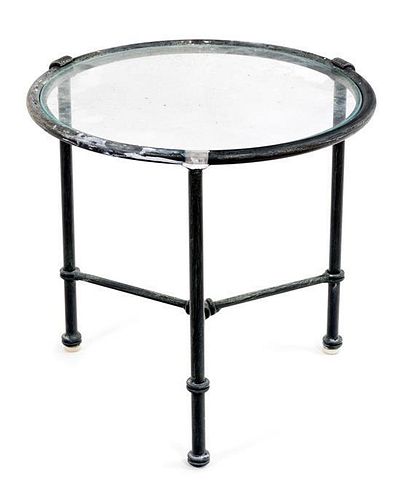 A Metal Circular Side Table Height 18 3/4 x diameter 19 1/4 inches.
