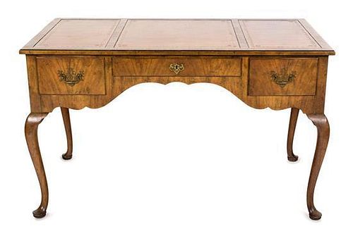 A Queen Anne Style Walnut Desk Height 20 x width 49 x depth 27 inches.