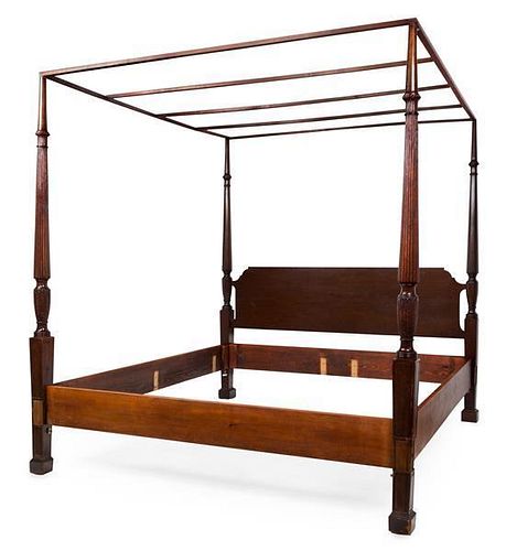 An English Carved Mahogany Four-Poster Bed Height 87 1/2 x width 82 x depth 82 inches.