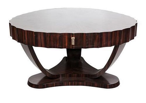 An Art Deco Walnut and Marquetry Breakfast Table Height 19 x width 54 1/2 x depth 31 inches.